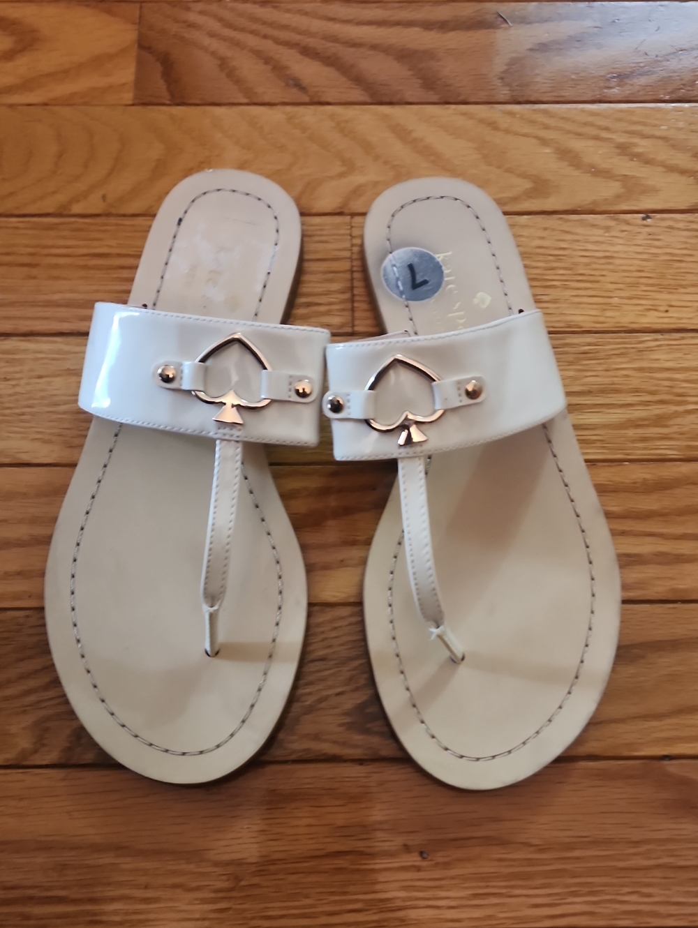 Kate Spade Cassia White Patent Leather Thong Sandals with Gold Spade Accent